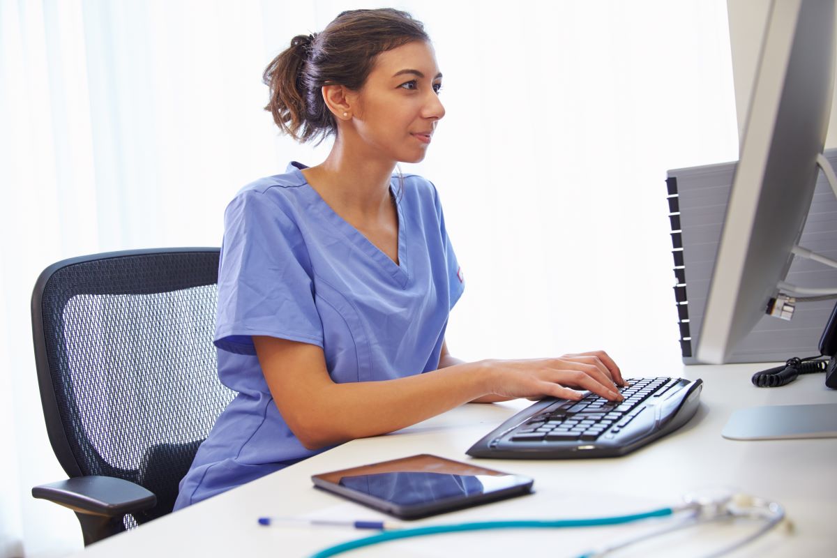 Nurse on a computer looking at a healthcare website design