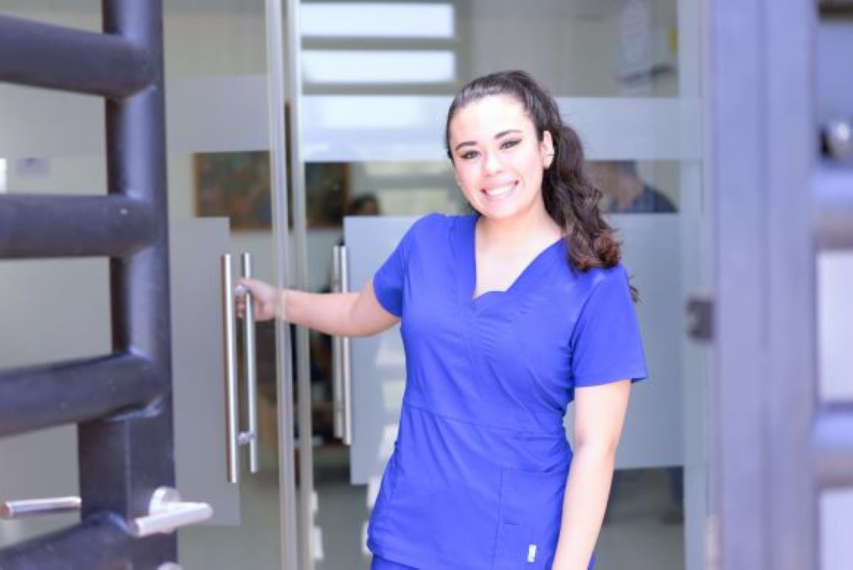 Nurse opening the door of a magnet nursing facility