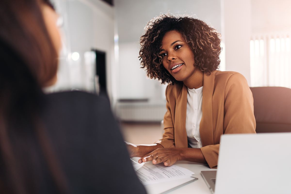 Nurse Recruiter interviewing a nursing candidate in an office