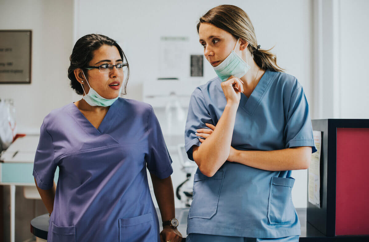 Two nurses talking in a difficult situation.