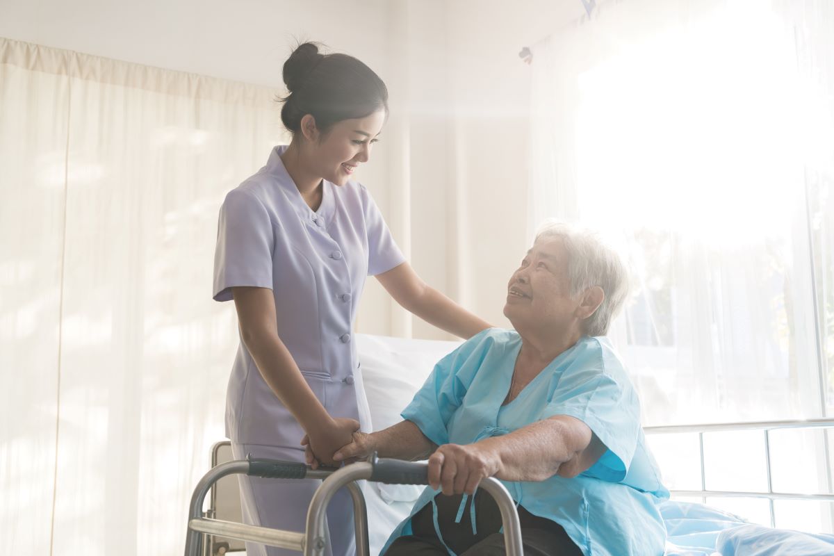 A nurse providing a high quality of care to a nursing home patient.
