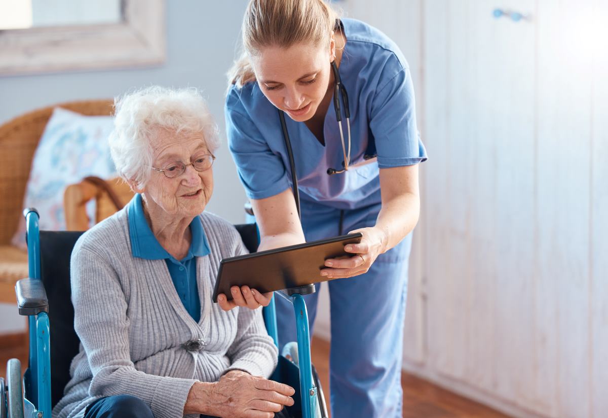 Nurse checking chart with patient