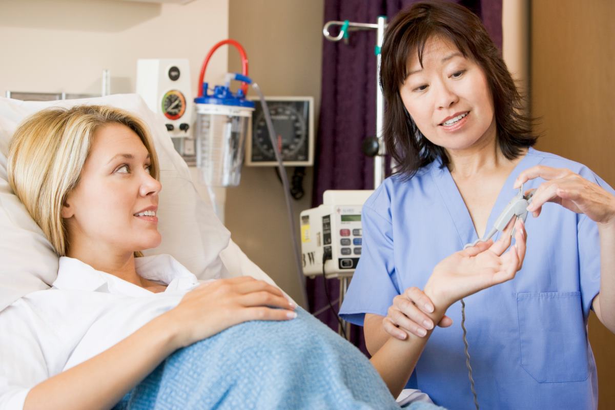 Nurse midwife caring for a pregnant patient