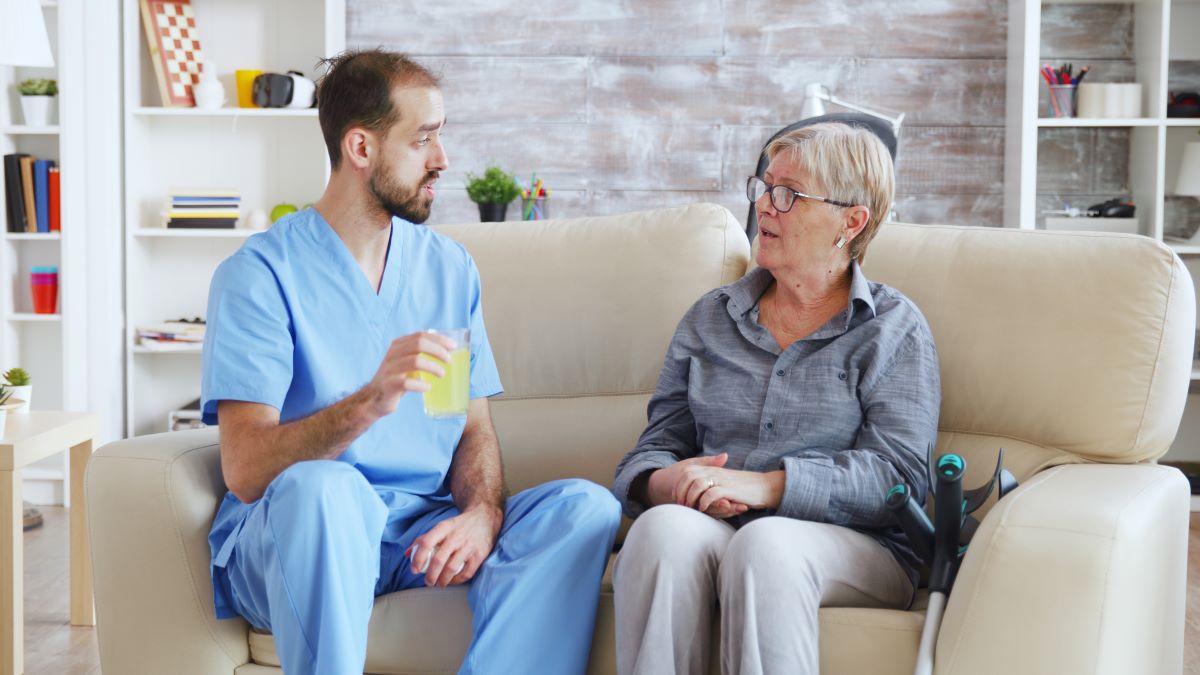 Nurse practicing therapeutic communication