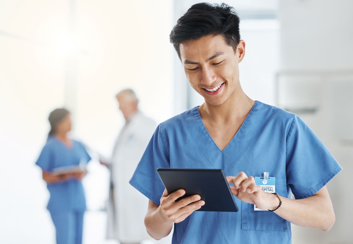 Research nurse using a tablet