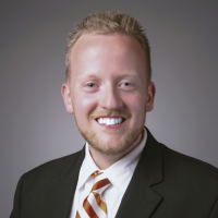 Man wearing a dark suit and tie