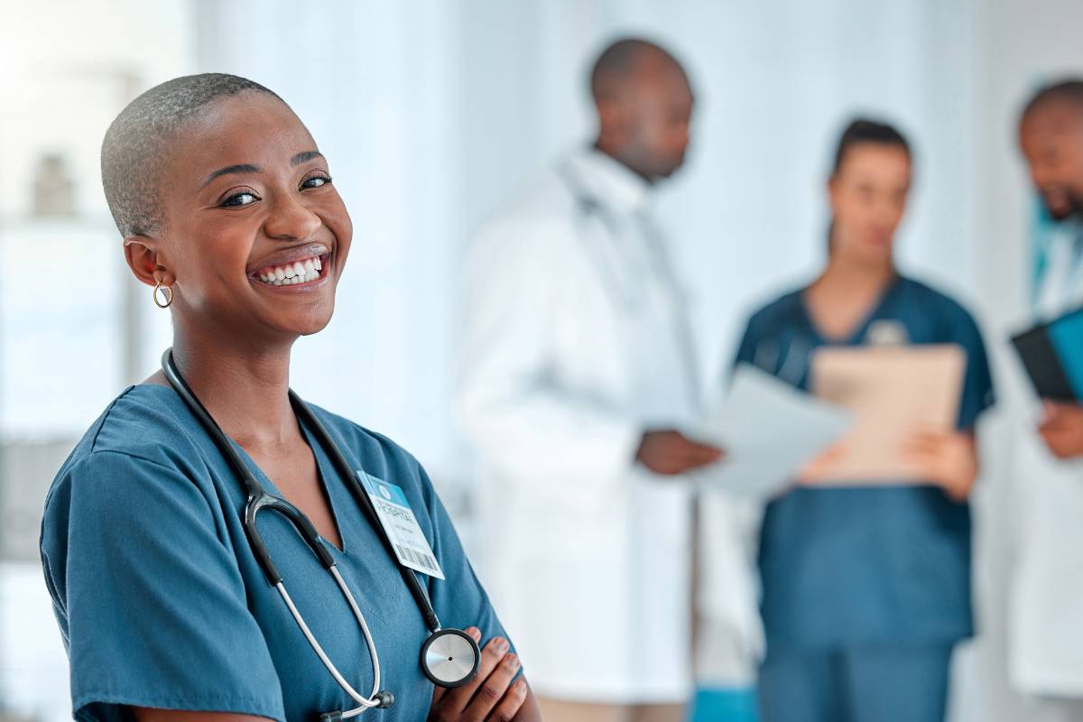 A nurse enjoys her registered nurse benefits while at her job.