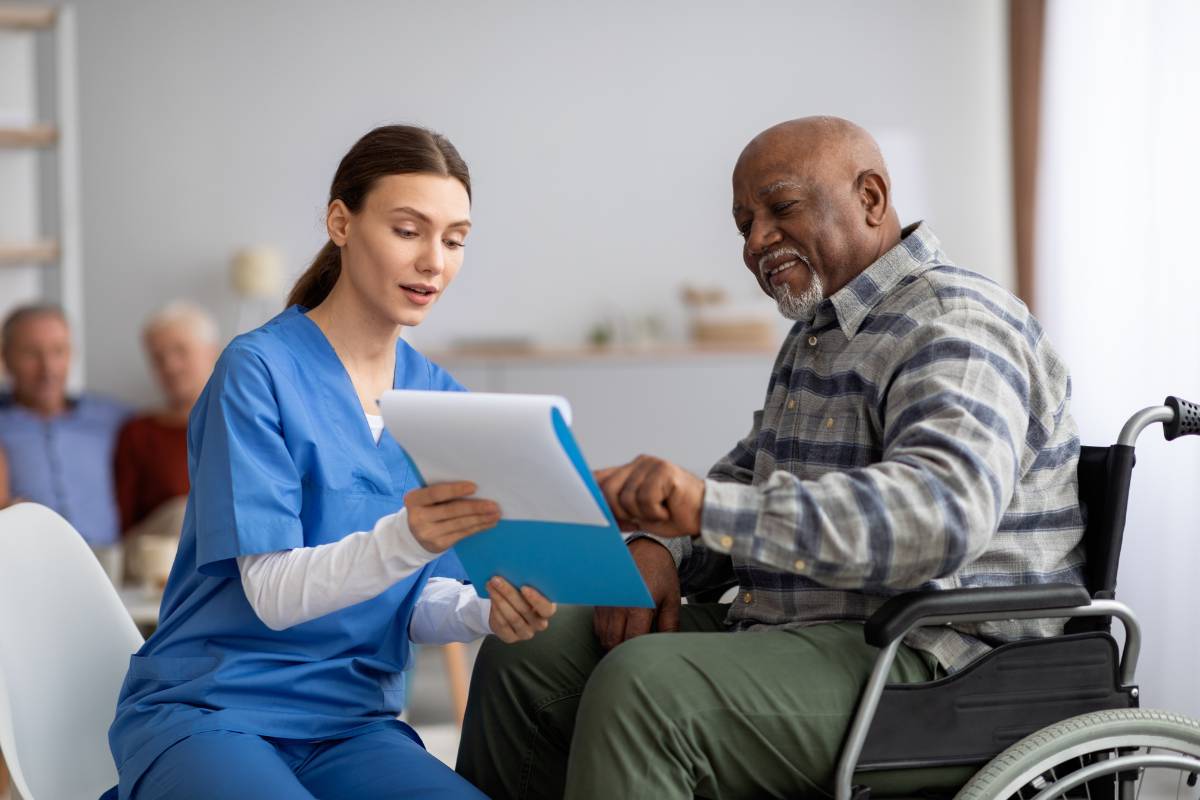 A geriatric care manager consults with a patient.