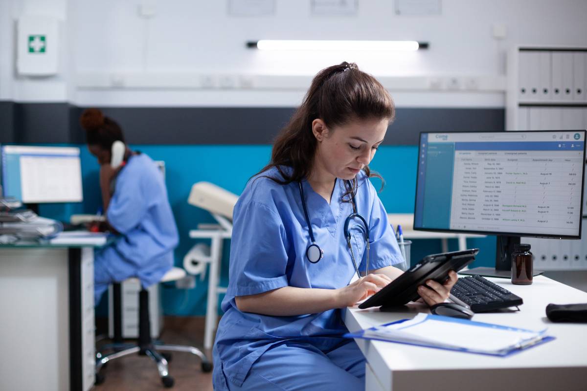 A nurse works on Epic charting for nurses.