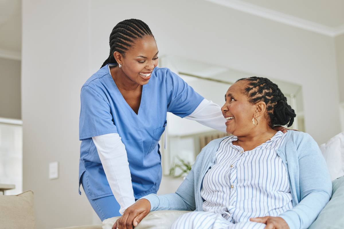 A nurse practices holistic nursing with a patient.