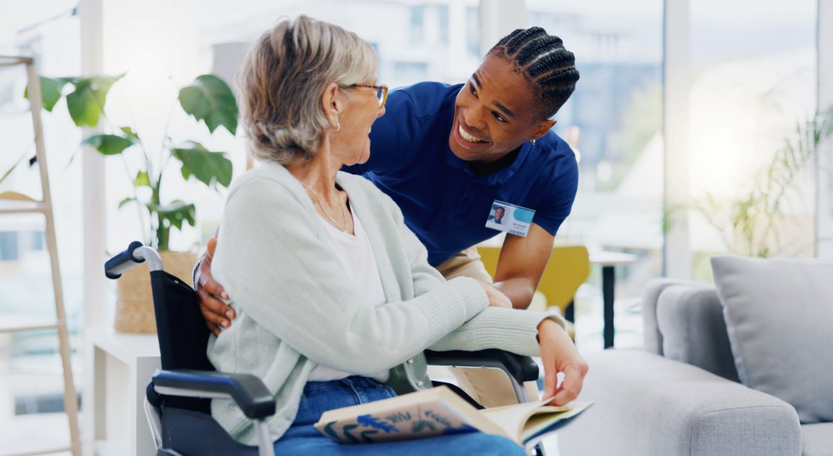 A nurse interacts with one of the residents at the nursing home where he works.