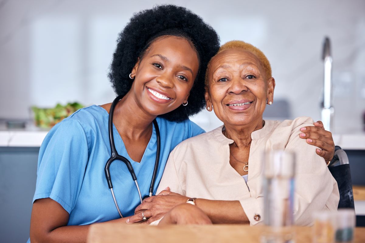 A nurse embracing one of the residents she cares for.