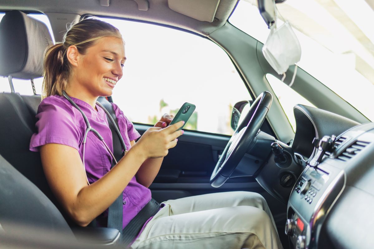 A travel nurse checks the address for her next visit.