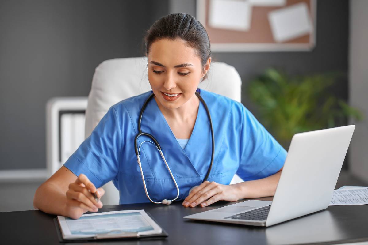 A nurse works on her utilization review nurse cover letter.