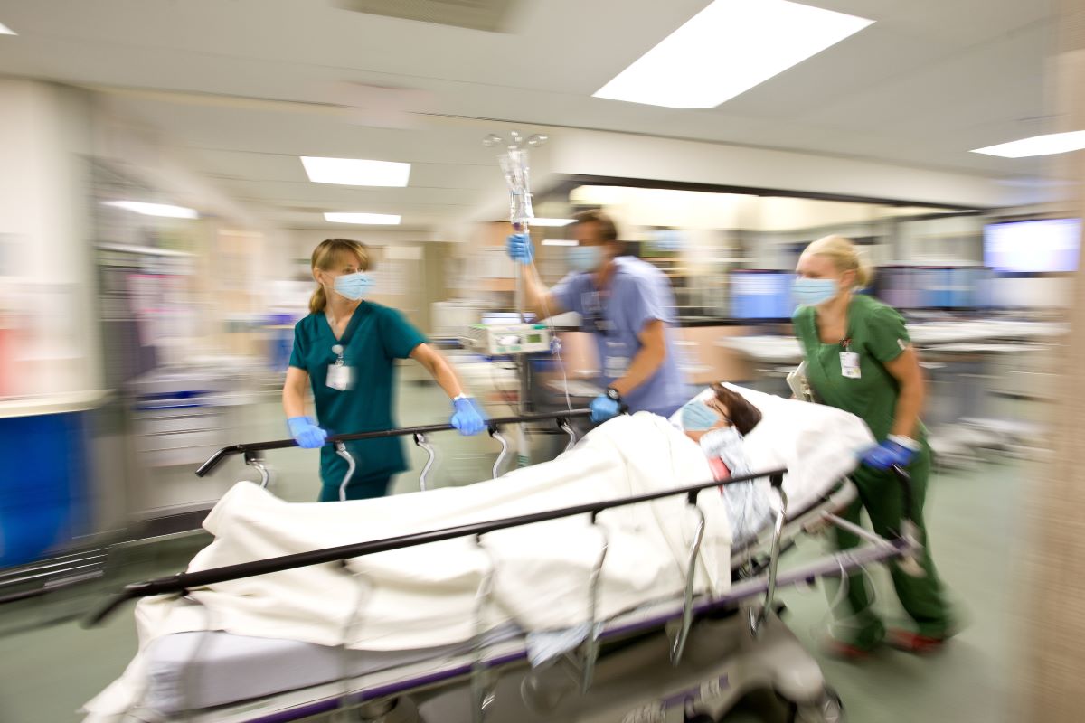 ER nurses rush a patient to surgery.