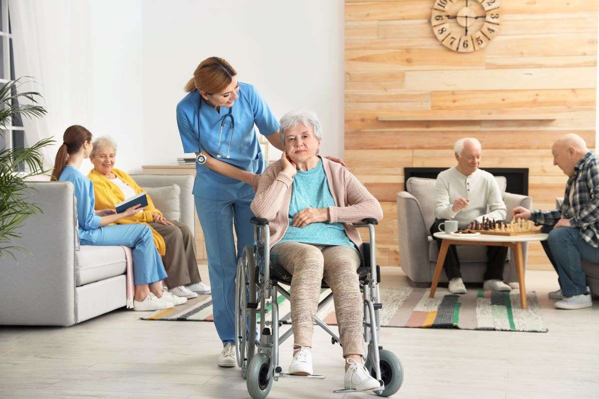 Nursing home residents and staff in common area