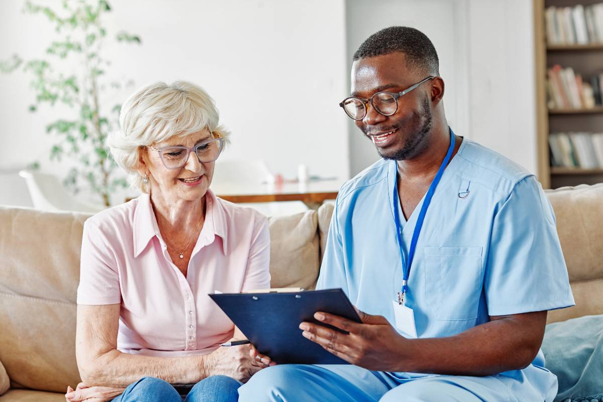 A pain management nurse explains a care plan to their patient.