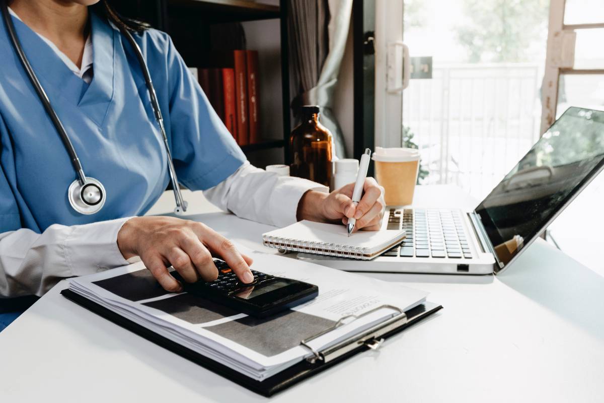 A nurse works on their travel nurse taxes at home.