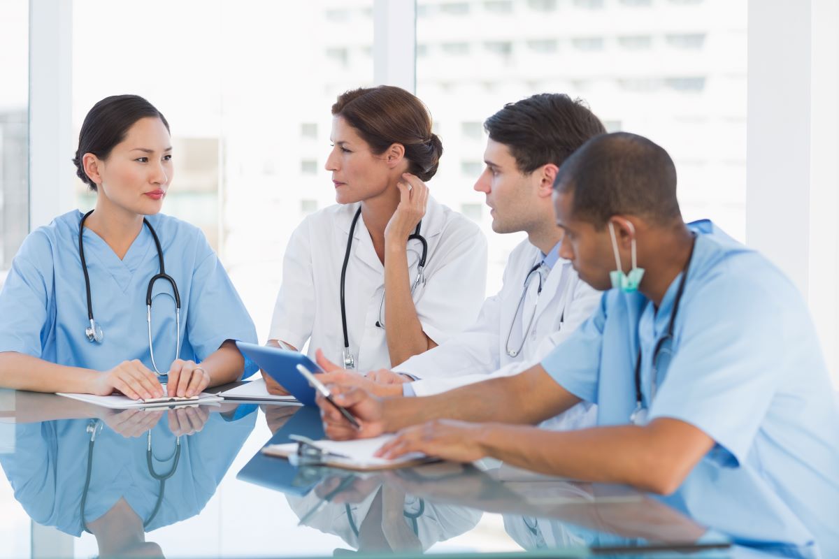 A group of nurses and physicians discuss the information they've gleaned from various employee feedback tools.