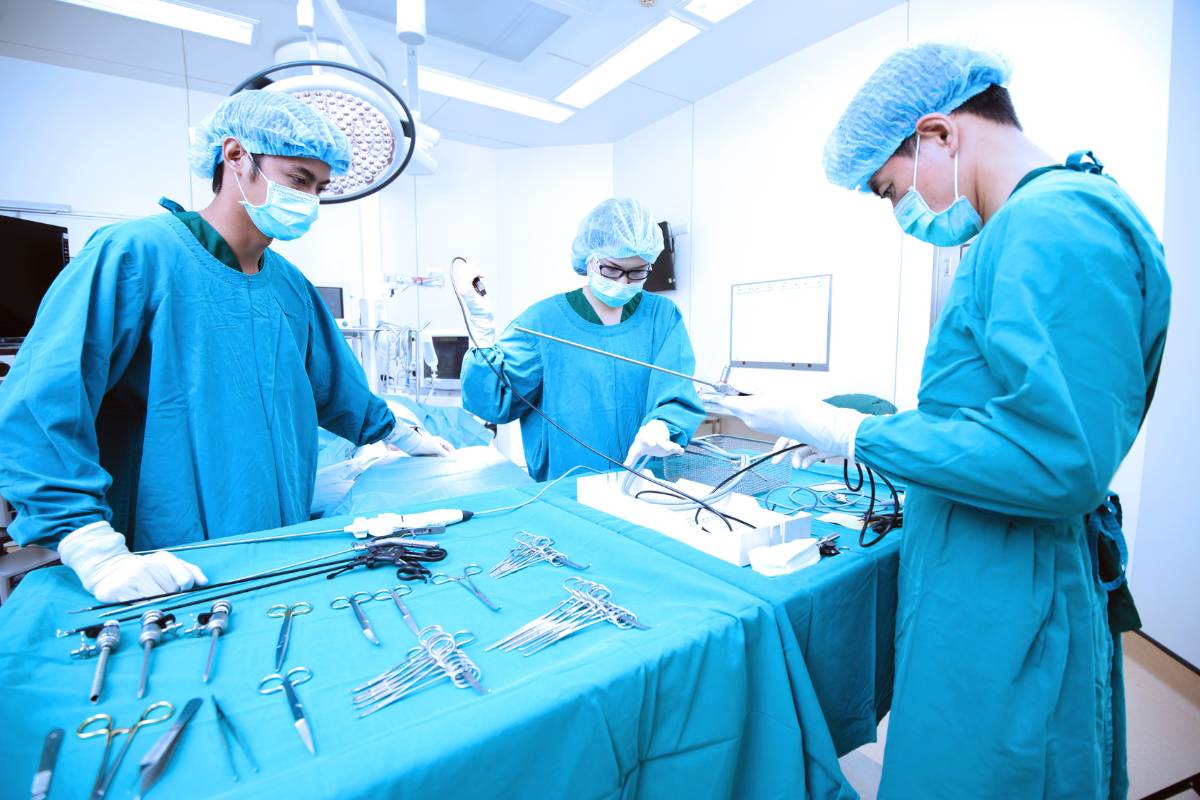 A group of professionals demonstrate how to become a surgical tech while they prepare for surgery.