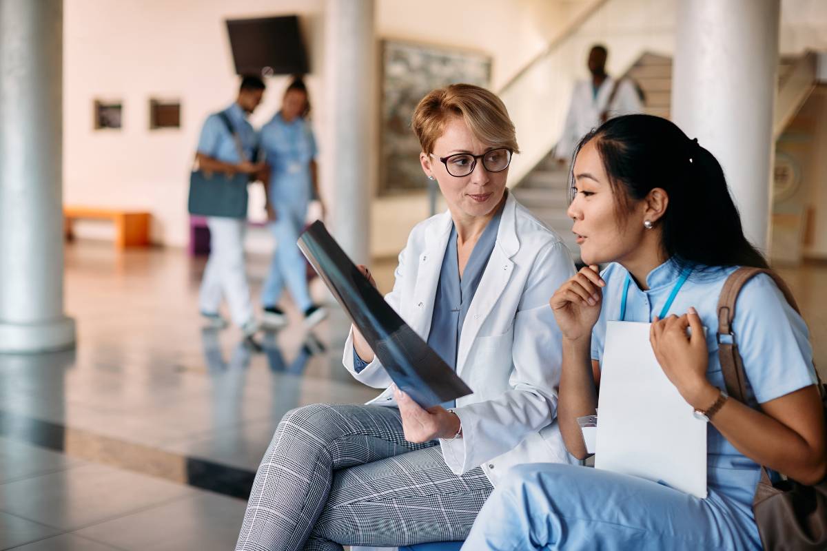 A teacher uses her nurse educator cover letter skills while assisting a student.