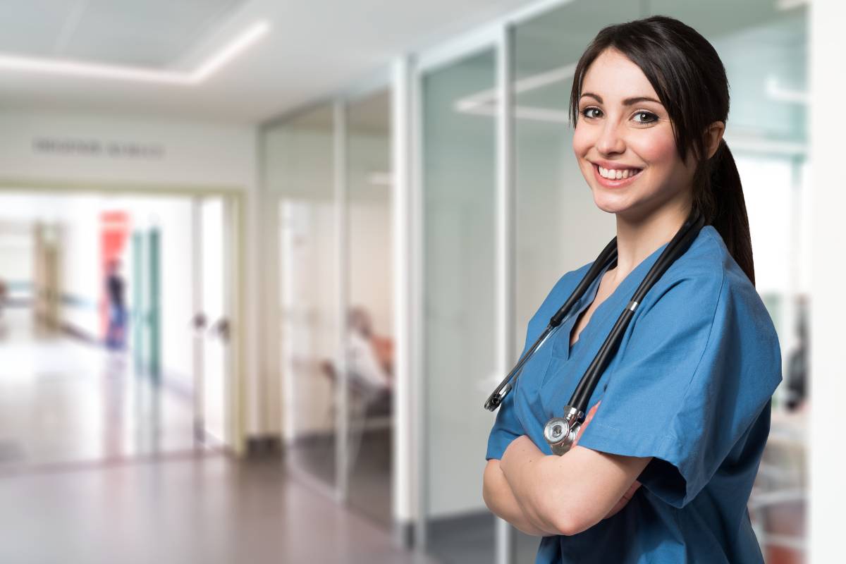 A nurse demonstrates her PCU nurse resume skills at work.