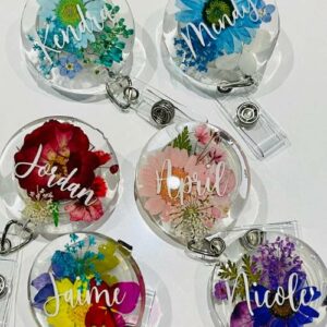 Badge reels with flowers on them.